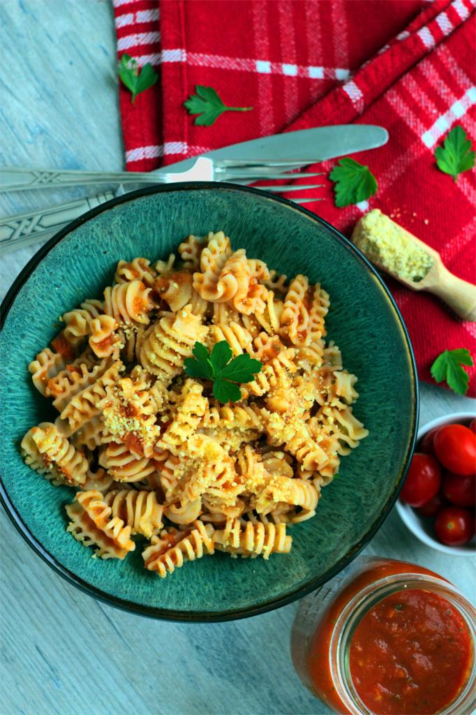 Bird view of a pasta bowl with marinara sauce