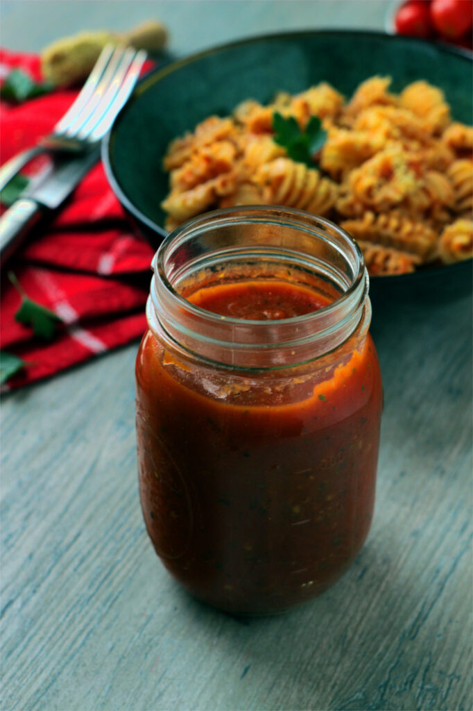 Jar with vegan marinara sauce.
