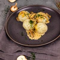 Vegan potato dumplings with majoram and creamy mushroom gravy