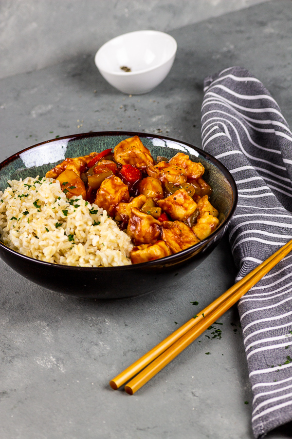 vegan sticky glazed tofu with rice in sweet sour sauce