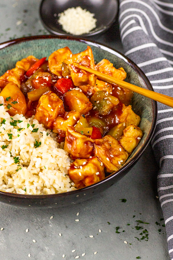 vegan sticky glazed tofu with rice in sweet sour sauce