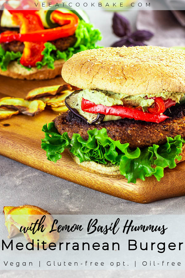 Two vegan Mediterranean Burgers with Lemon Basil Hummus on a wood board