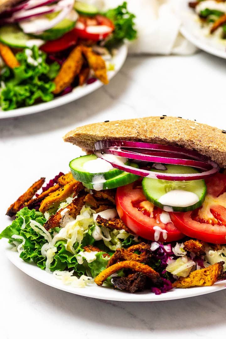 Vegan Kebab Sandwich on a plate with a vegan garlic sauce
