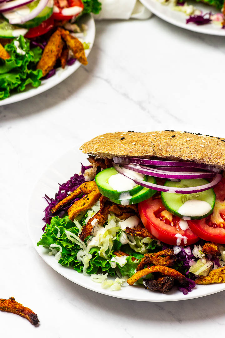 Vegan Doner Kebab with whole spelt / wheat kebab bread, coleslaw, soy curls / seitan and kebab sauce.