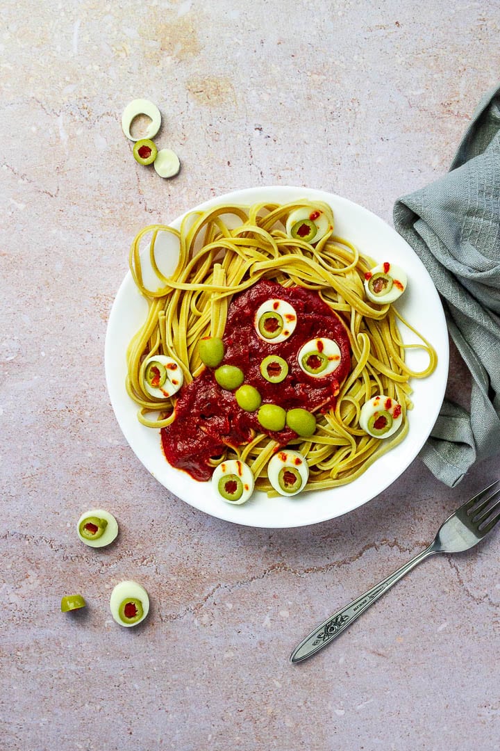 Vegan Dinner Idea for Halloween. Whole Grain Spaghetti with oil-free tomato sauce an veggie eyeballs