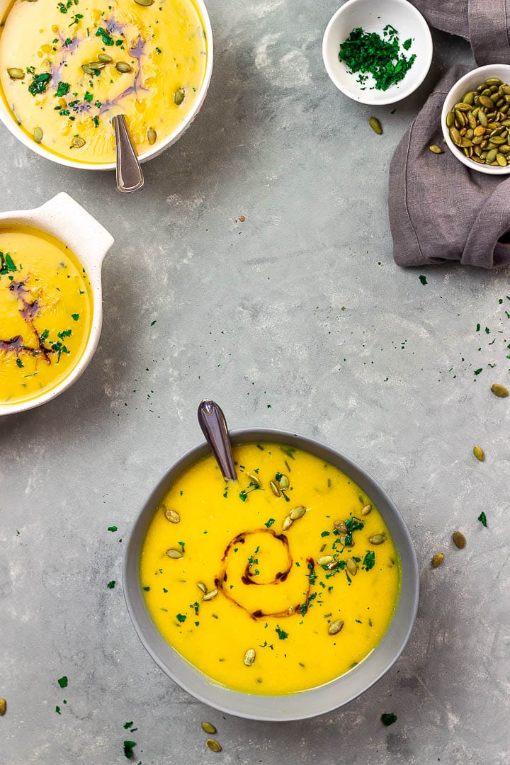 Vegan Roasted Pumpkin Soup which is creamy and made without oil. Topped with pumpkin seed, balsamic and herbs