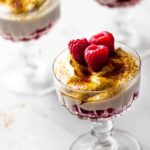 Vegan Dessert with Raspberries and a dairy-free cream topped with some coconut sugar or brown sugar