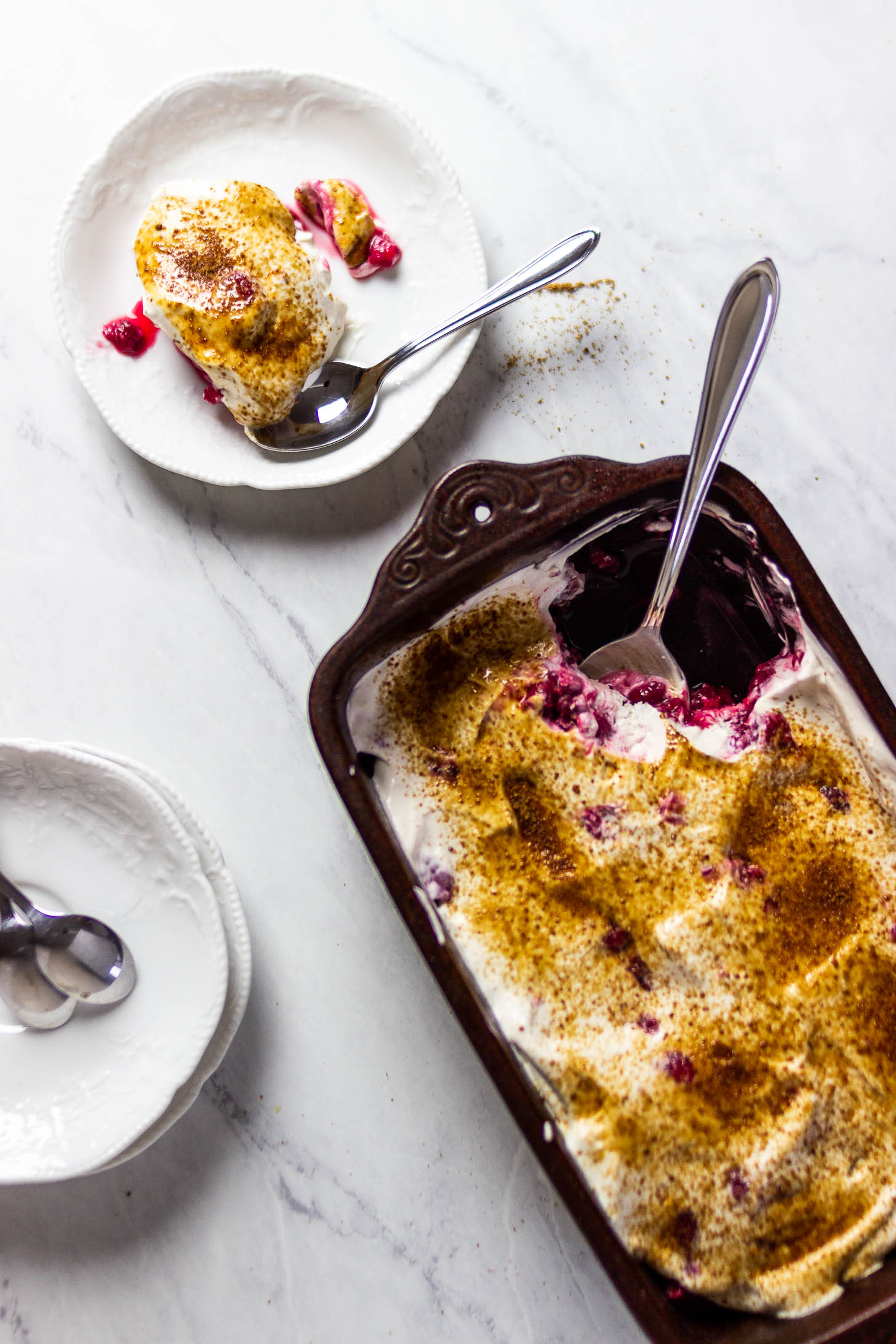 Vegan Dessert with Raspberries and a dairy-free cream topped with some coconut sugar or brown sugar