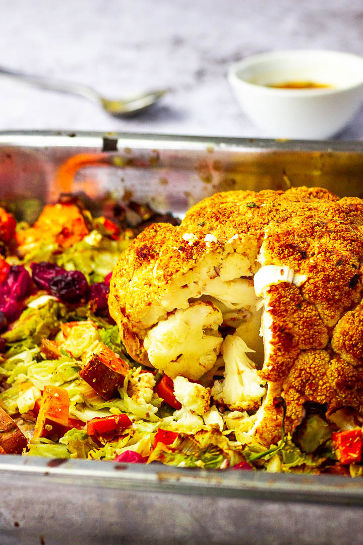 Vegan Roasted whole Cauliflower for your thanksgiving center piece. Cripsy Roasted with a turkey marinade.