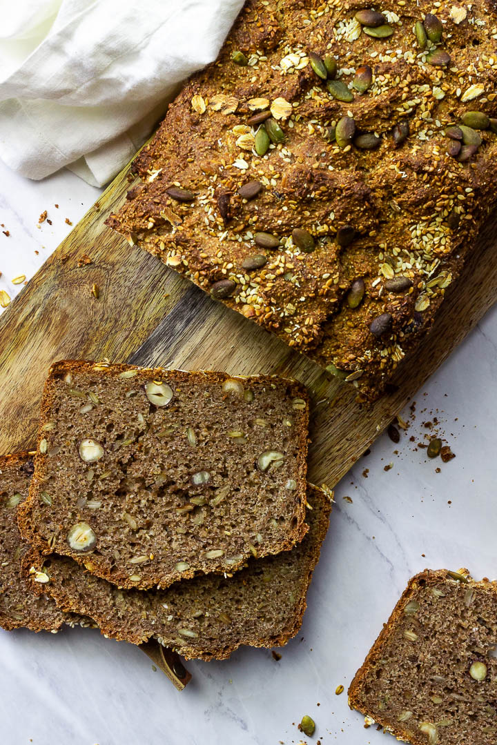 Whole Grain Bread with Seeds and Nuts on a Wooden Board