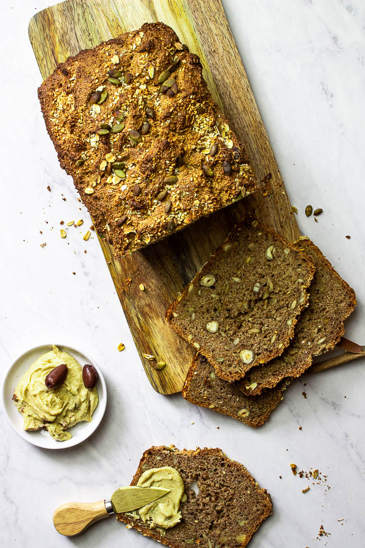 Whole Grain Bread with Seeds and Nuts on a Wooden Board