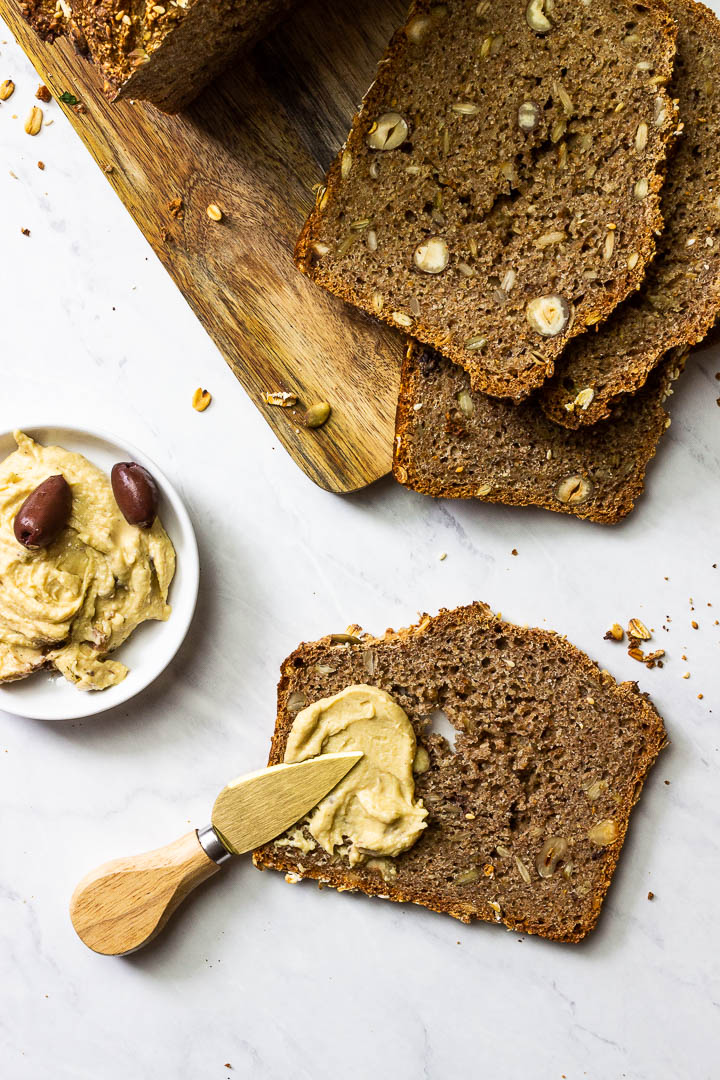 Whole Grain Bread with Seeds and Nuts on a Wooden Board