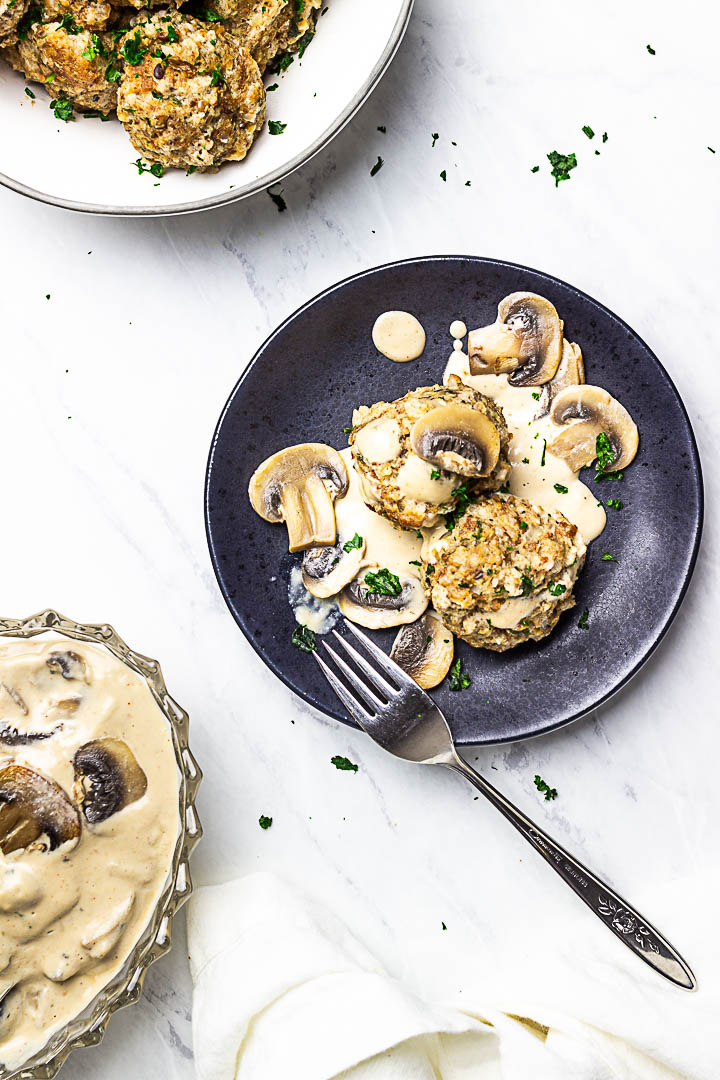 Vegan Semmelknödel are German Bread Dumplings. Presentation in a bowl with some mushroom stroganoff