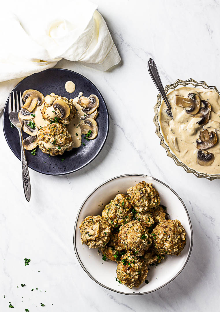 Vegan Semmelknödel are German Bread Dumplings. Presentation in a bowl with some mushroom stroganoff