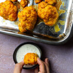 Vegan Buffola wings made with cauliflower. This authentic buffalo sauce fits perfect to cauliflowers and a vegan ranch dip (wfpb)