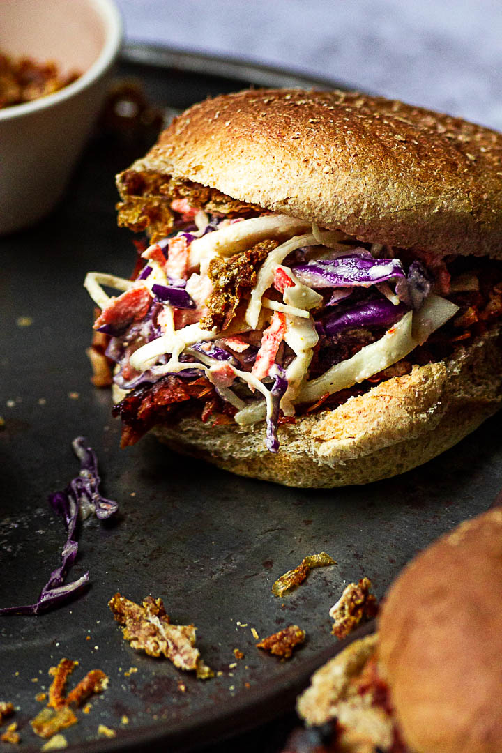 Vegan Pulled Pork made with Jackfruit, BBQ Sauce topped with Coleslaw and homemade oil-free french fried onions