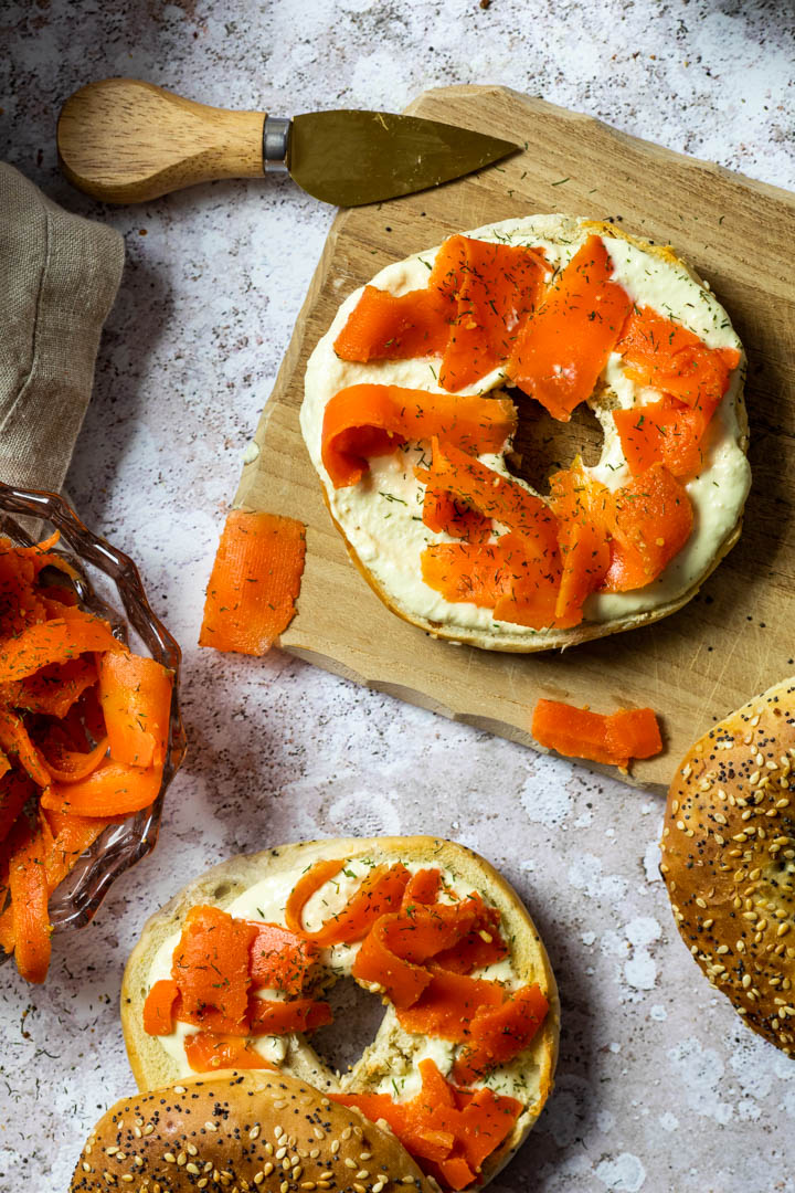 Vegan smoked salmon made with carrots. Wfpb carrot lox on a bagel with homemade oil-free horseradish dip