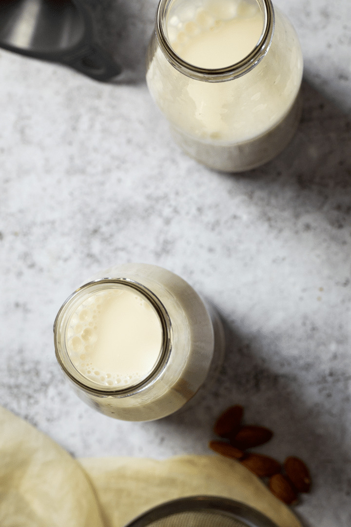 Two Jars with hoememade Almond Milk, in bird view