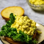 Close up of vegan egg salad on a bun