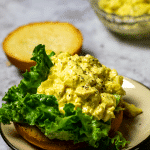 Close up of vegan egg salad on a bun