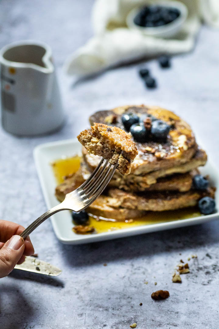 A piece of vegan french toast on a fork