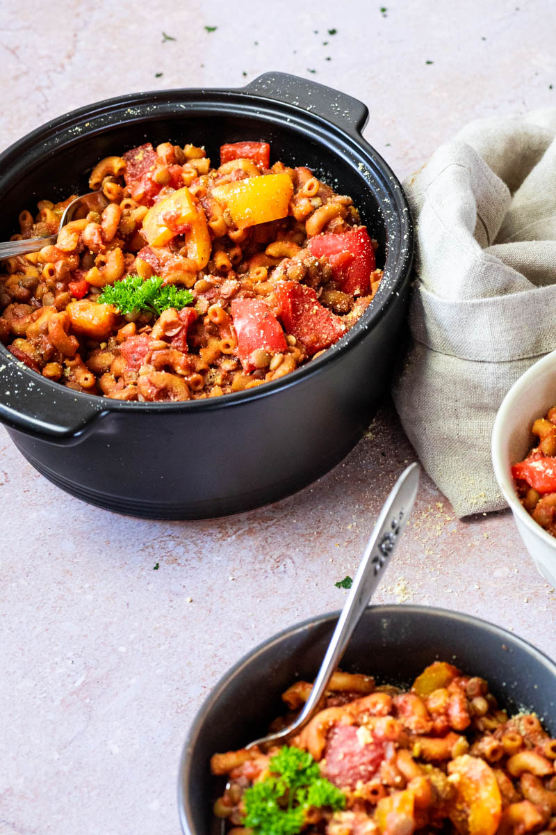 Pot with Pasta Goulash (american style) with some little bowls in front