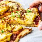 Graphic of pizza hawaii with text