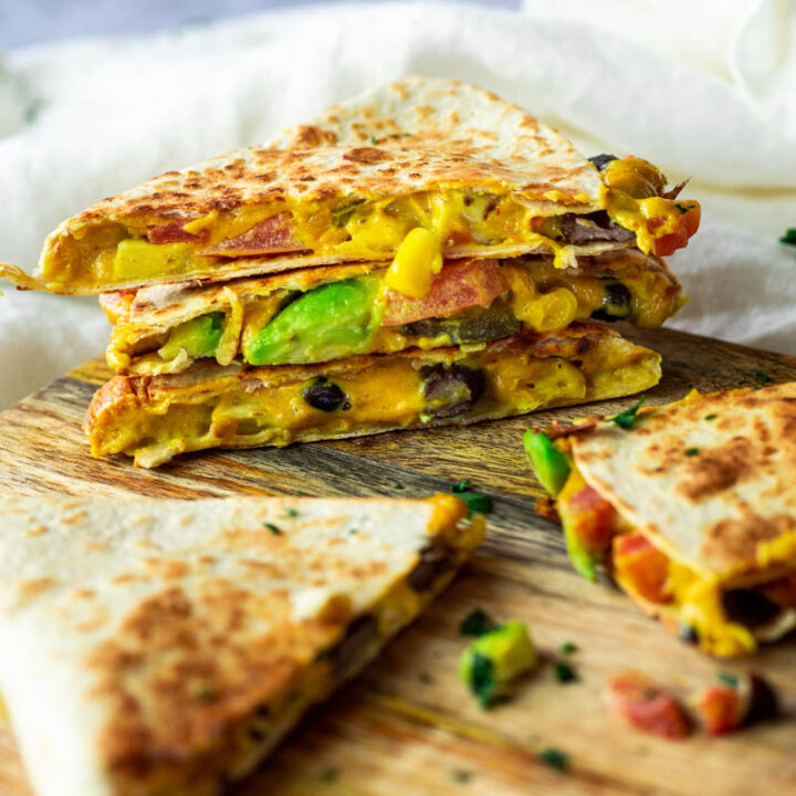 Vegan Quesadillas filled with veggies and a homemade vegan quesco cheese sauce