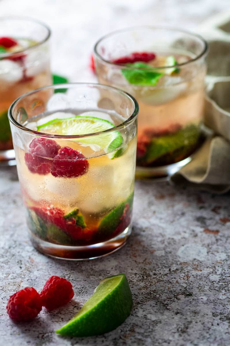 3 jars with raspberry mojito cocktail