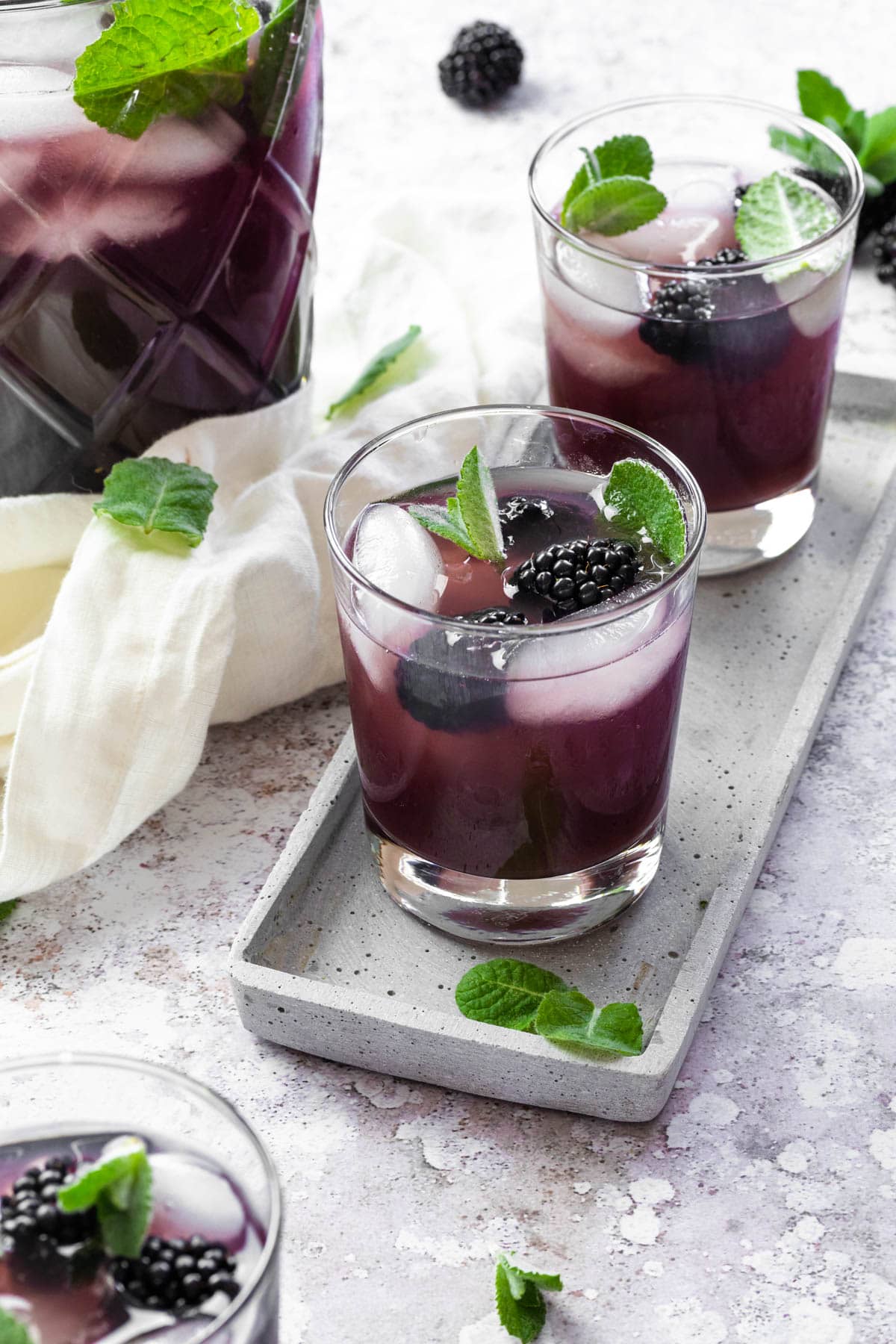 2 jars with homemade sugar free blackberry iced too. Served on a tablet and a pitcher in the background