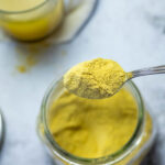 A spoon full with vegan chicken bouillon powder