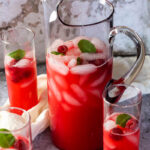 Pitcher with sugar-free raspberry limade in focus