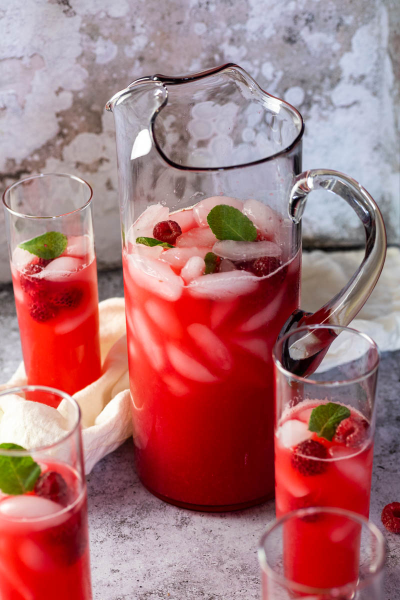 Pitcher with sugar-free raspberry limade in focus