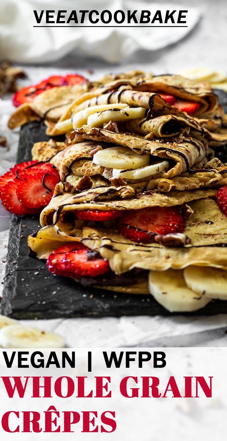 Crepes on a stone plate filled with brownie hummus, strawberries and banana with text.