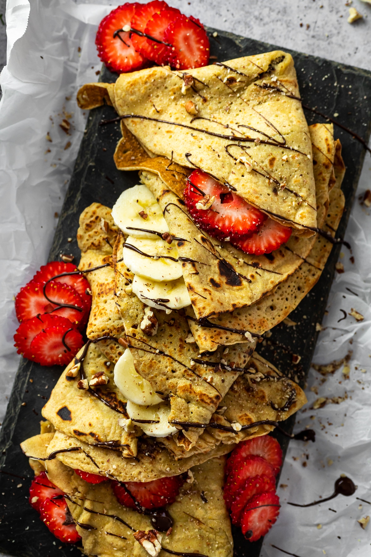 Whole Wheat Crepes filled with fresh strawberries, banana and dessert hummus