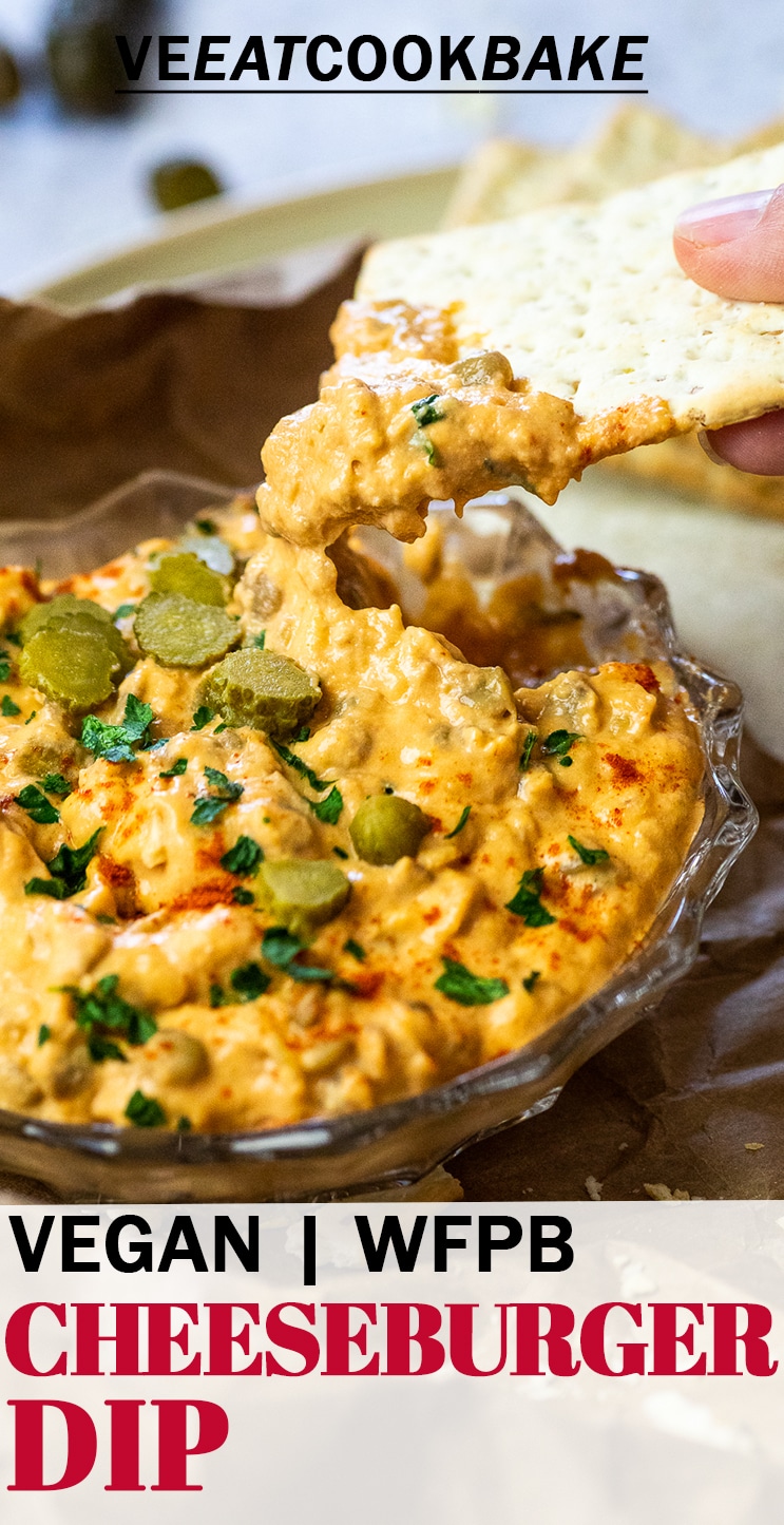 Dipping a cracker in a vegan cheeseburger dip with text