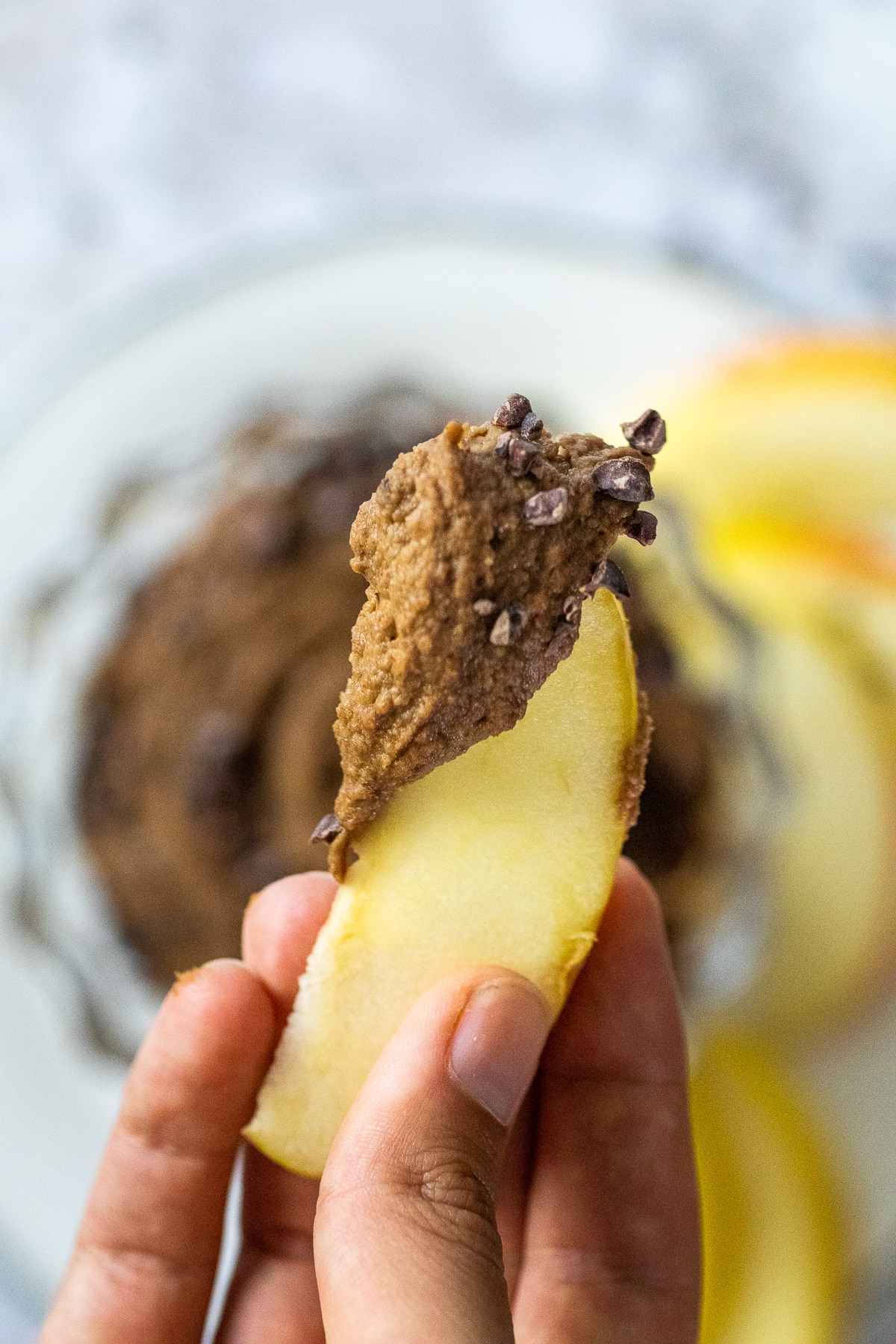 One apple slice with brownie batter on it.