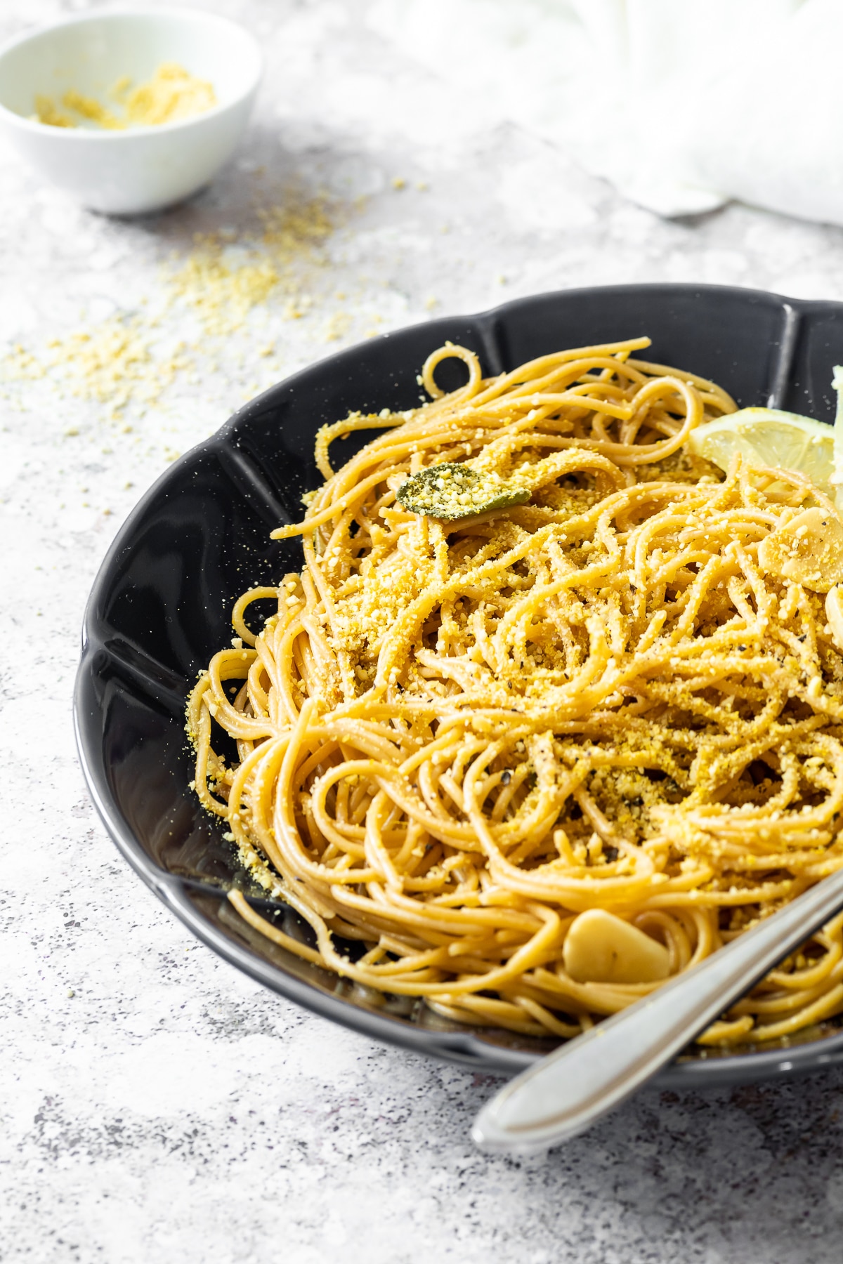 Close up view of a bowl with sage spaghetti