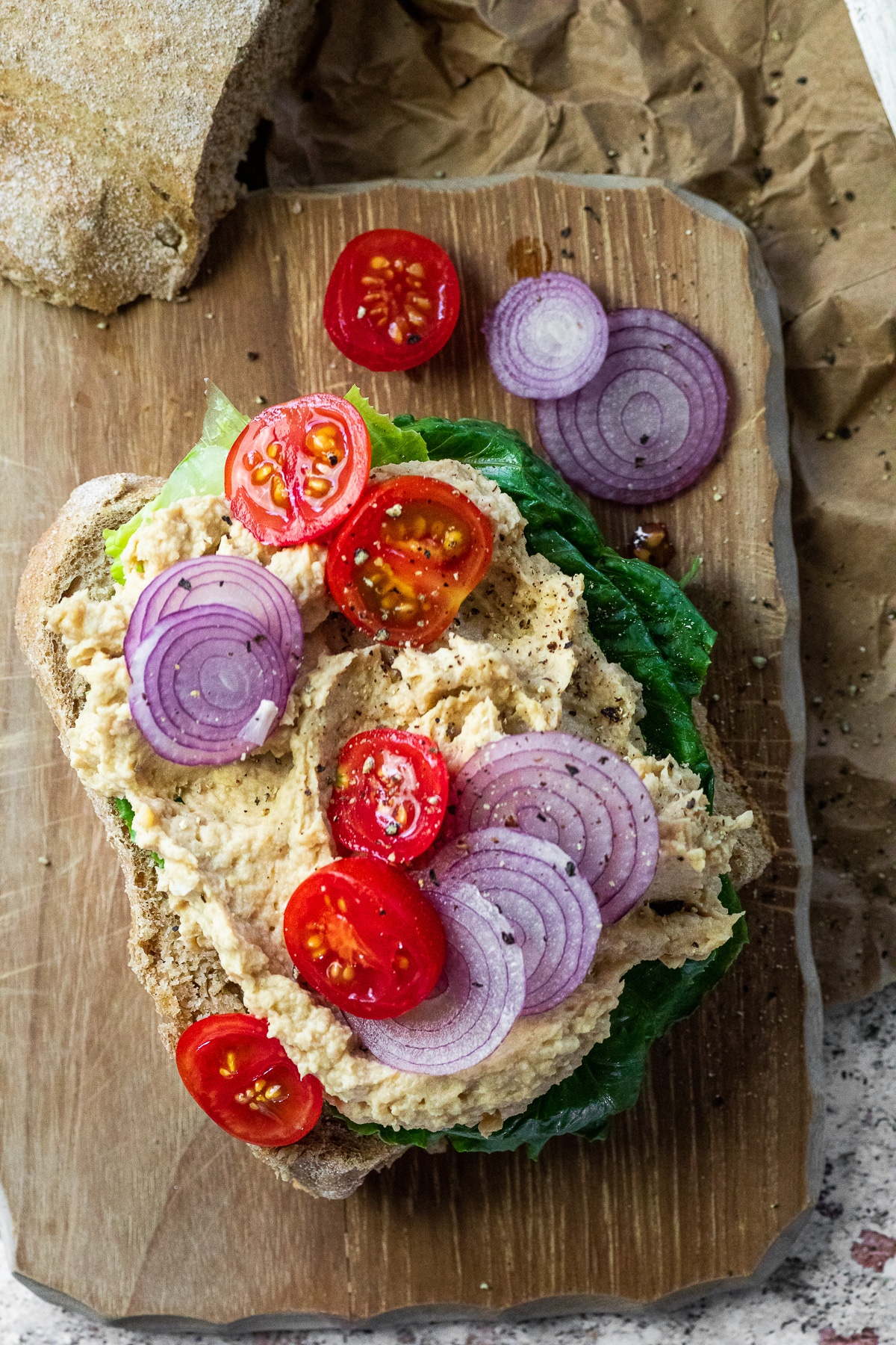 Close up of an open vegan tuna salad sandwich