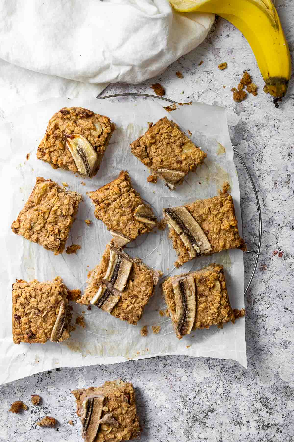 Oat Bars with Banana on a wire rack with parchment paper.