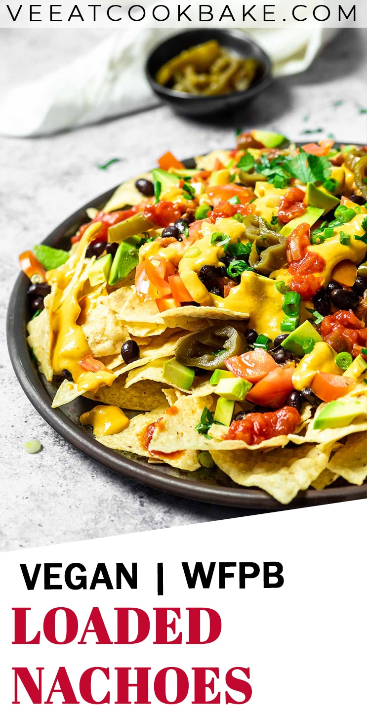 Vegan loaded nachos served on a platter with text