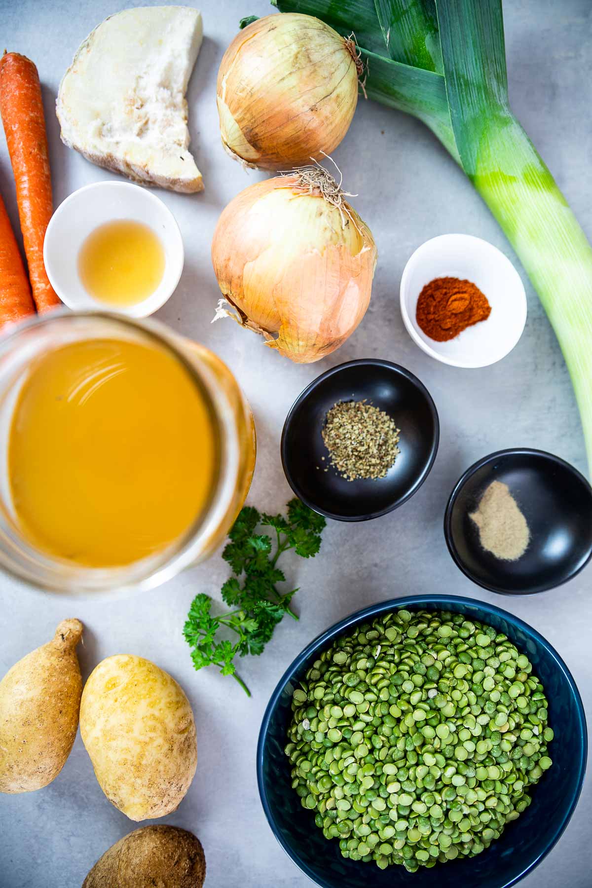 Ingredient shot of vegan split pea soup: Split peas, veggie broth,, celeriac, onions, leek, potatoes, carrots