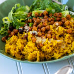 One turmeric rice bowl in the back of another bowl.