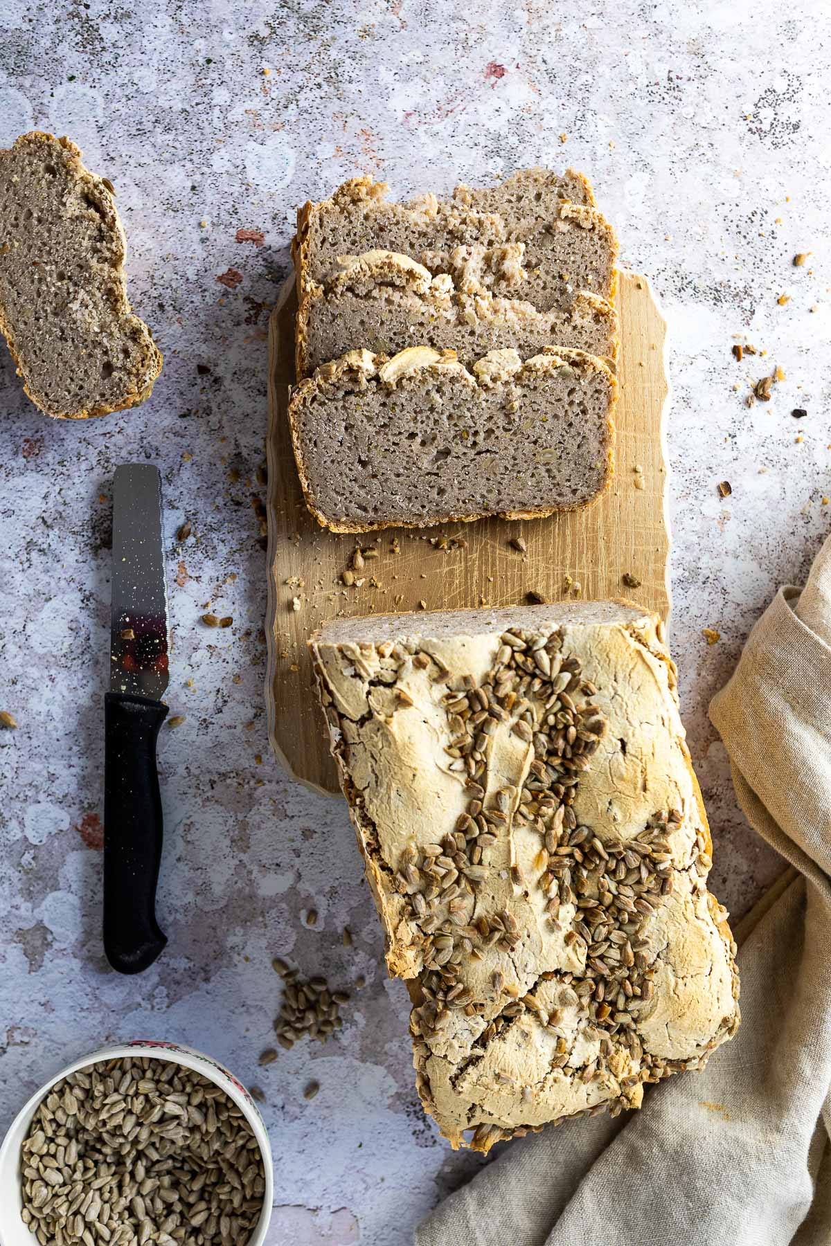 Gluten free Buckwheat Breat on a wooden Board with some slices in front