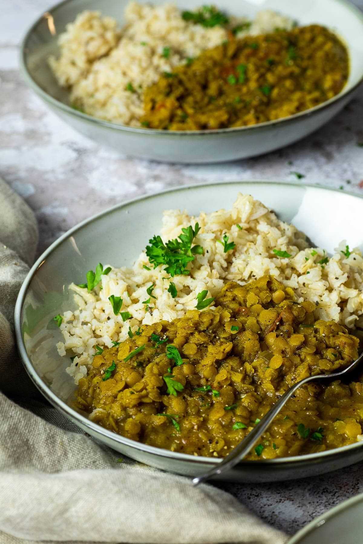 Bowl of vegan red lentil dal in focus