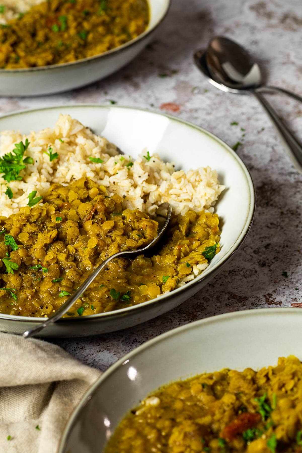 Bowl of vegan red lentil dal in focus