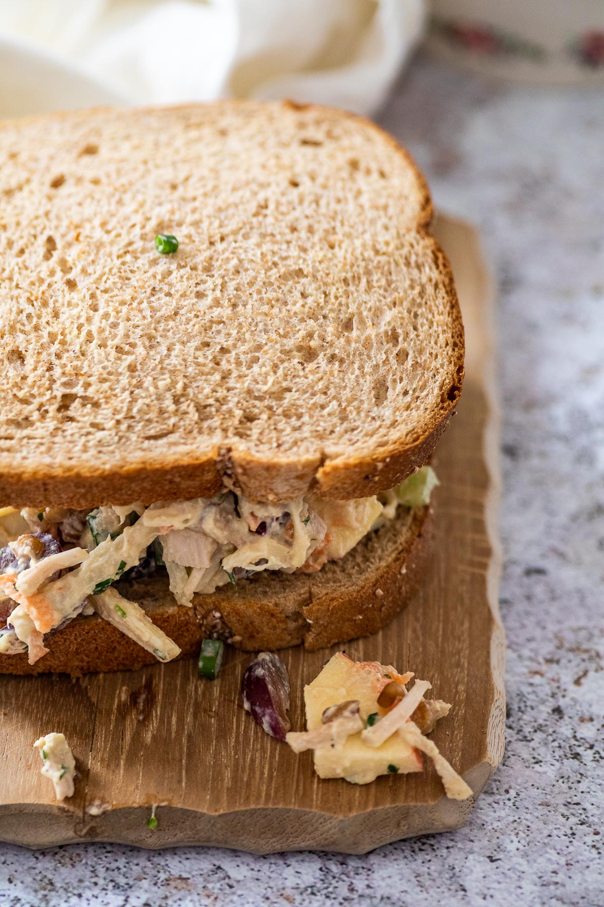 Sandwich with vegetarian chicken salad served on a board