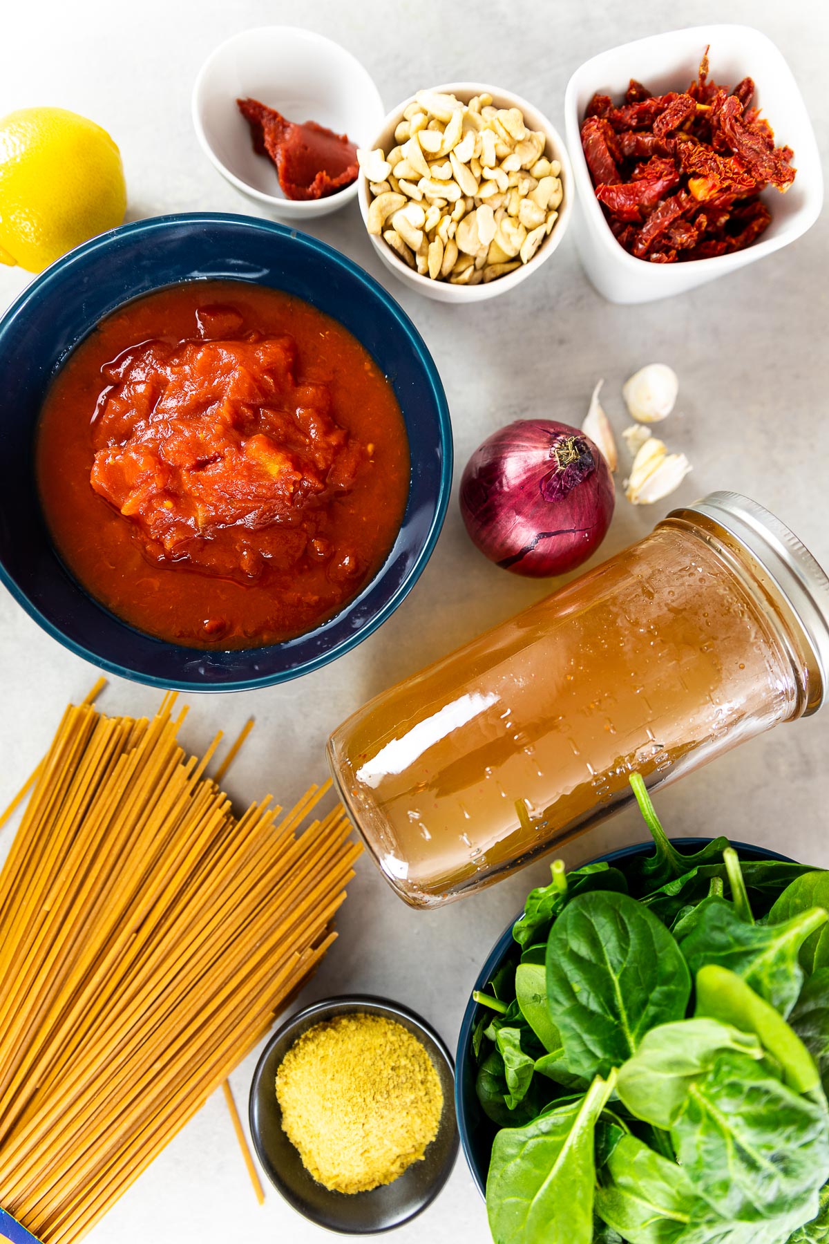 Ingredient shot for the tomato alfredo sauce with sun dried tomatoes and spinach